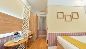 Postel nebo postele na pokoji v ubytování Sao Vang Hotel