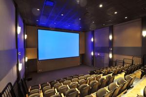 an empty auditorium with a large screen in the middle at Luxury Resort 2BR/2Bath Sleeps 6 in Canmore