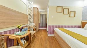 Postel nebo postele na pokoji v ubytování Sao Vang Hotel
