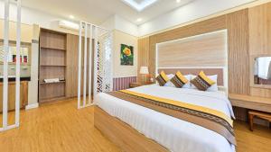 Postel nebo postele na pokoji v ubytování Sao Vang Hotel