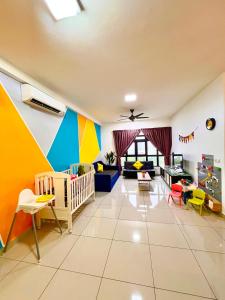 a nursery with a crib and a room with colorful walls at Legoland -8min Walk-Spacious Kids friendly -500MBS-1-12Pax Kairos Stay in Nusajaya