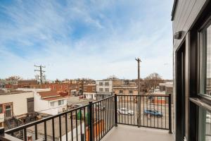 a balcony with a view of a city at Big 2 bedroom apartment on 2 floors - 1907 in Montréal