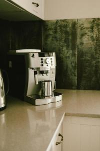 a coffee maker sitting on a counter in a kitchen at Hunter Moon Country House, Hunter Valley in Broke