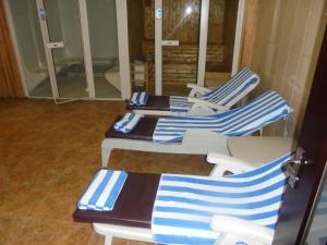 a group of blue and white chairs in a room at Saro Maria Hotel in Addis Ababa