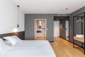 Postel nebo postele na pokoji v ubytování Hotel Forum Ceao