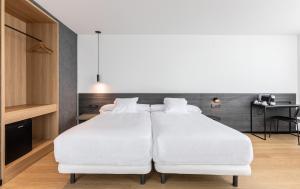 Postel nebo postele na pokoji v ubytování Hotel Forum Ceao