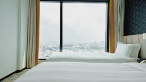 Holiday Inn Express Singapore Katong by IHG客房内的一张或多张床位