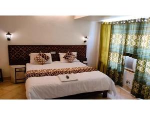 Кровать или кровати в номере Hotel Amulya Shree, Bhopal