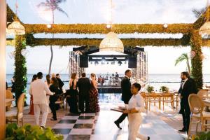 a wedding reception at the beach with a bar at Lujosa Villa en Casa de Campo Golf La Romana R.D in La Romana