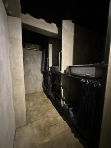 an empty room with a staircase in a building at Cilacap Guest House in Cilacap