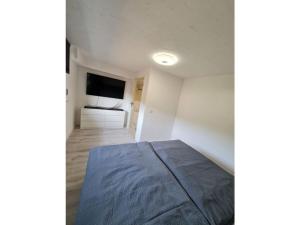 En eller flere senge i et værelse på Holiday apartment Glockenhorn