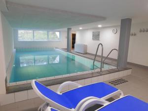 a large swimming pool with at Rüm Hart I - Apartment 9A in Hörnum