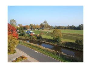 a view of a road next to a river at "At Low 8" Merchant in Horumersiel