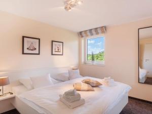 Ένα ή περισσότερα κρεβάτια σε δωμάτιο στο Dünenhuus West Modern retreat