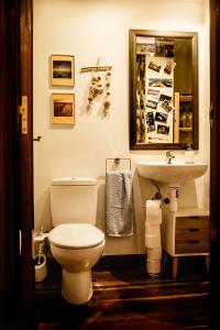 a bathroom with a toilet and a sink at Zuhaitz in Azpeitia