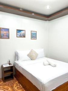 Postel nebo postele na pokoji v ubytování Corazon El Nido Inn