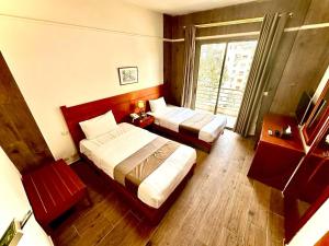 Voodi või voodid majutusasutuse Caesar's Park Hotel toas