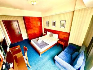 Postel nebo postele na pokoji v ubytování Caesar's Park Hotel