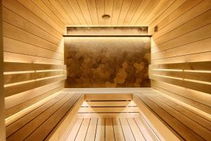 a wooden sauna with a wooden floor and a wall at Nunne Boutique Hotel in Tallinn