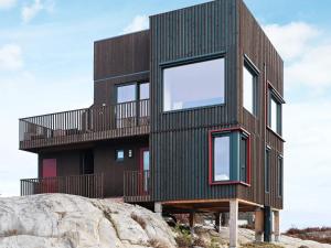 a house on top of a rock at 6 person holiday home in Søndeled in Søndeled