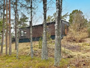 a house in the middle of the woods at Holiday home ORNÖ II in Ornö