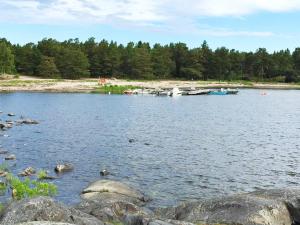 a view of a lake with boats on the shore at 7 person holiday home in GRISSLEHAMN-By Traum in Grisslehamn +9 photos