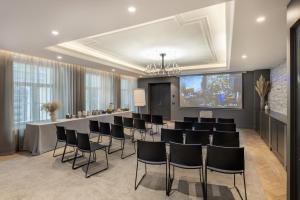 a meeting room with a long table and chairs at Nunne Boutique Hotel in Tallinn +93 photos