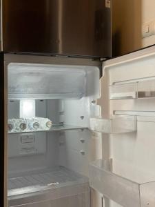 an empty refrigerator with its door open in a kitchen at HMJ4 2BR stylish apartment on 36th floor KKC City center in Khon Kaen