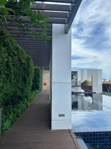 a building with a white pillar in the middle of a walkway at HMJ4 2BR stylish apartment on 36th floor KKC City center in Khon Kaen