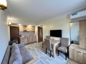 a living room with a couch and a table at The Hill Guesthouse in Yerevan