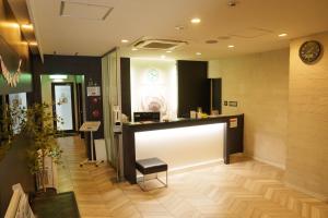 TV a/nebo společenská místnost v ubytování Osaka City Hotel Kyobashi
