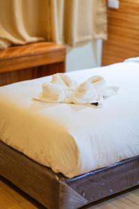 Postel nebo postele na pokoji v ubytování Raim Hotel