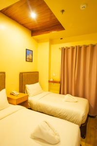 Postel nebo postele na pokoji v ubytování Raim Hotel