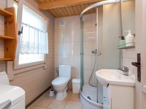 a bathroom with a toilet and a shower and a sink at Holiday house for 5 people, Jaros awiec in Jarosławiec