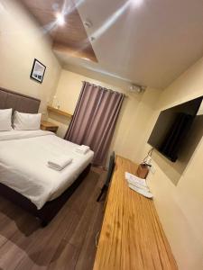 Postel nebo postele na pokoji v ubytování Raim Hotel