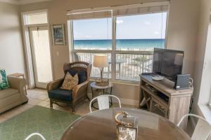 a living room with a view of the ocean at Beach Front Destin Condo Daily Beach Service - Blue Dolphin in Fort Walton Beach