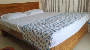 Postel nebo postele na pokoji v ubytování Great Hornbill Homestay, Ratnagiri
