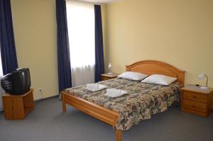 Postel nebo postele na pokoji v ubytování Hotel Tukums