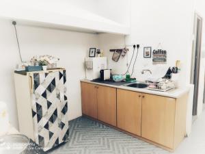 a kitchen with a sink and a counter at Hideaway ~ Best Memories start here! in Mersing