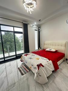 Postel nebo postele na pokoji v ubytování Peaceful Homestay