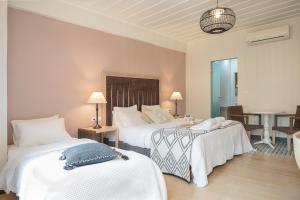 Postel nebo postele na pokoji v ubytování Vranas Ambiance Hotel