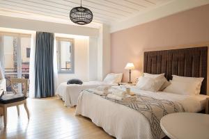 Postel nebo postele na pokoji v ubytování Vranas Ambiance Hotel