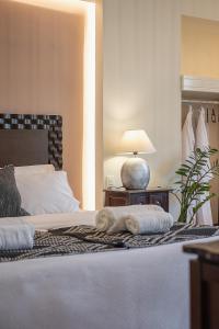Postel nebo postele na pokoji v ubytování Vranas Ambiance Hotel