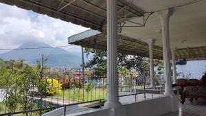 a view from the balcony of a house at Kalia Cottage in Batu