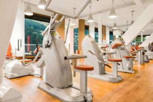 a gym with treadmills and elliptical machines at Ferienwohnung Kuckucksnest in Bad Wildbad