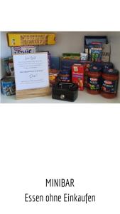 a shelf with some food and a sign on it at Ferienwohnung Bergzeit mit Pool und Sauna in Missen-Wilhams