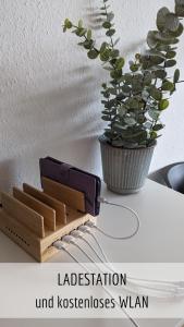 a table with a knife and a plant on it at Ferienwohnung Bergzeit mit Pool und Sauna in Missen-Wilhams