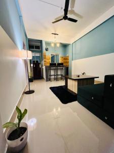 a living room with a couch and a table at Casa felice 1bhk lux suites in Tezpur +30 photos