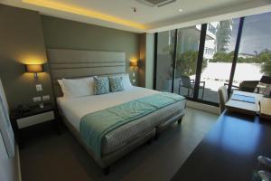 Ένα ή περισσότερα κρεβάτια σε δωμάτιο στο Hotel Poseidon