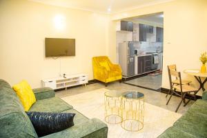 a living room with a couch and a table at One Bedroom, Lake View with GYM in Nakuru
